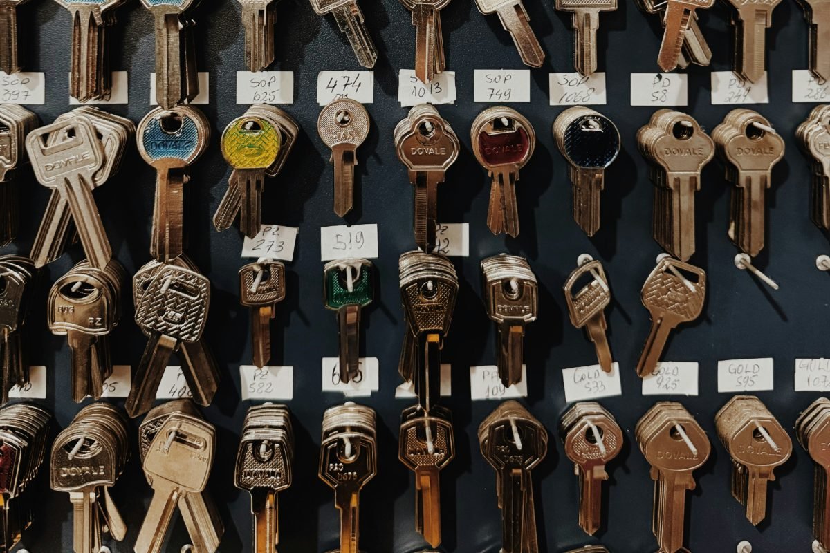 Key blanks hanging in numbered rows on a workshop board ready to be cut