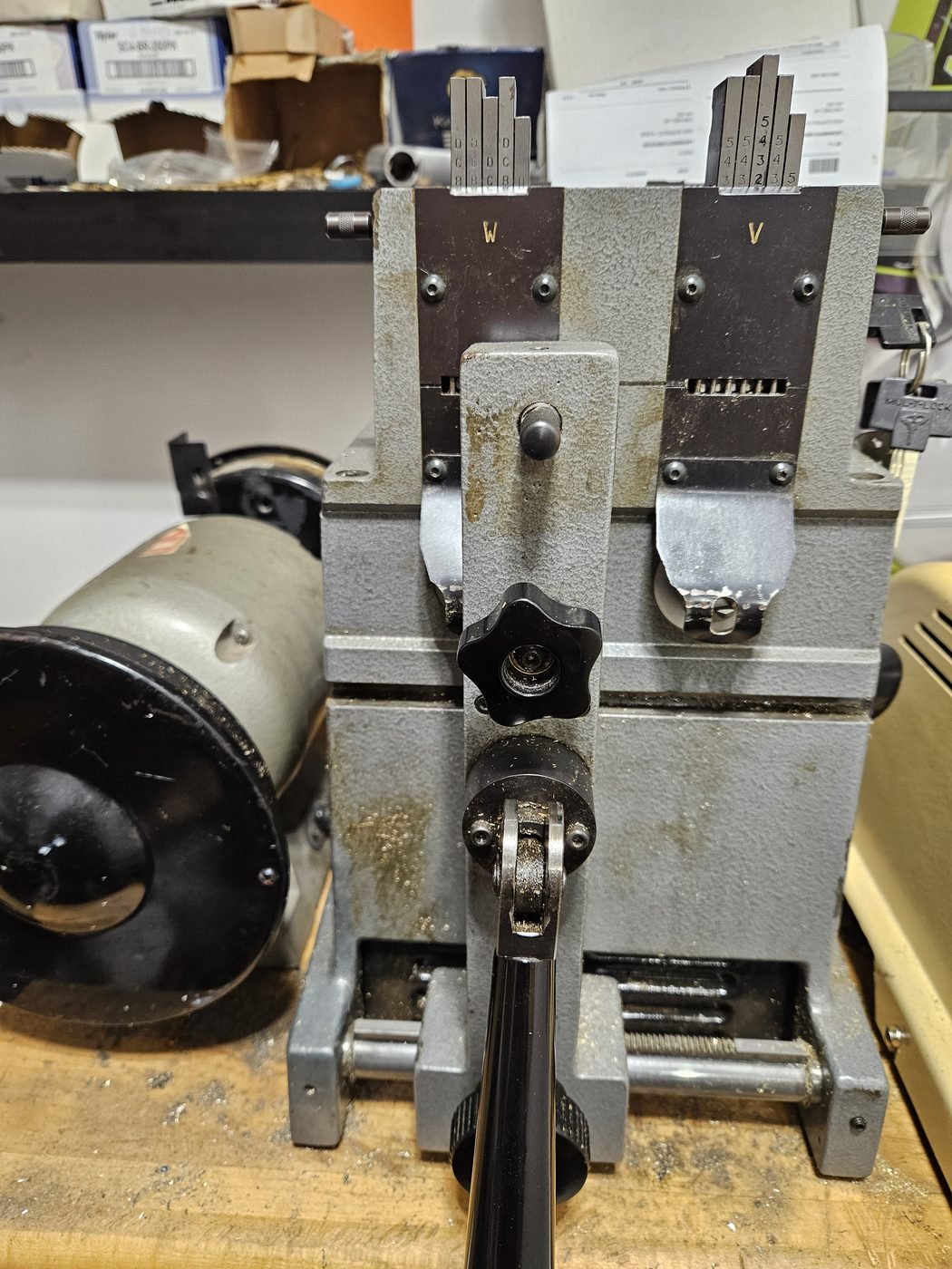 Key duplicating machine in the Woodbridge Locksmith workshop, with key blanks clipped behind it