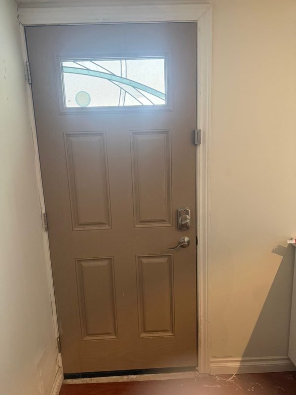 Residential entry door with a handleset and deadbolt installed by Woodbridge Locksmith
